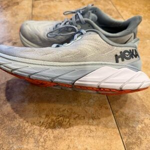 Hoka women’s Light baby blue and white athletic shoes are in good condition.